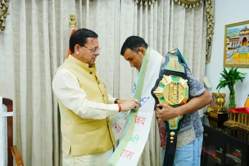 CM Dhami Felicitates MFN Lightweight World Champion Digambar Rawat