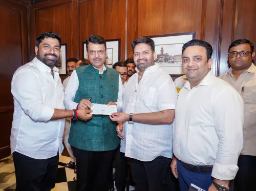 CM Fadnavis Receives ₹15 Lakh Cheque for Maharashtra Relief Fund