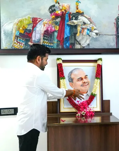 CM Revanth Reddy pays floral tribute to YSR on birth anniversary