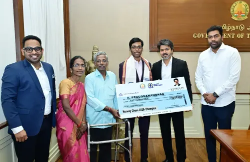 CM Vijay presents Rs 50 lakh cheque to Praggnanandhaa