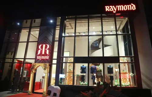 Why Did Income Tax Officials Conduct a Survey at Raymond Offices Across India?