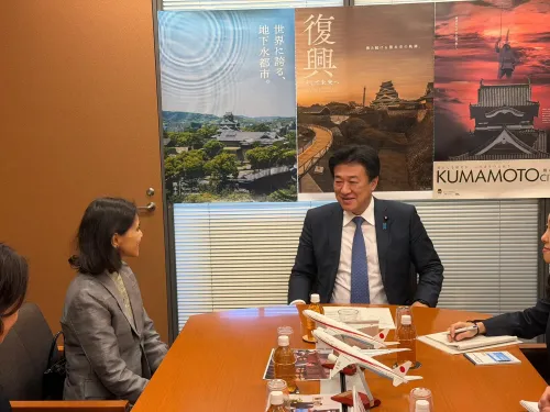 How are Indian envoy and Japan's Chief Cabinet Secretary working to strengthen bilateral ties?