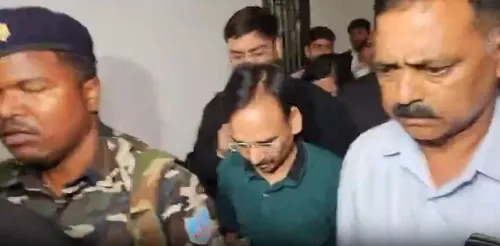 What led to the arrest of Jharkhand's former Excise Secretary Chaubey and an excise official?