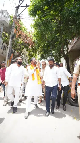 Kishan Reddy joins BJP workers, slum residents at community event