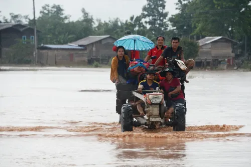 What is causing the widespread flooding in Laos?