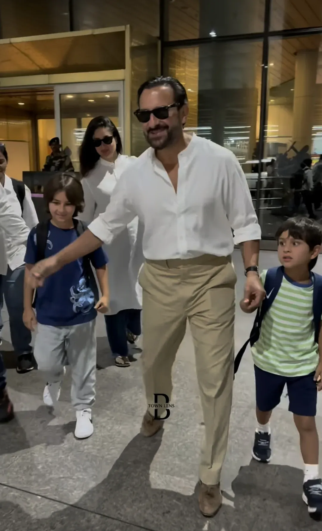 Taimur Ali Khan greets airport staff on return from Europe; Jeh steals the show