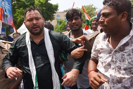 Tejashwi Yadav detained in Patna as police use water cannons on RJD march