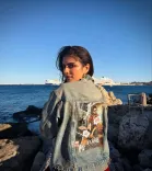 Is Actress Malavika Mohanan Sporting 'The Raja Saab' Poster in Greece?
