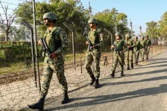 Who was the armed intruder stopped by BSF on the international border in Jammu?