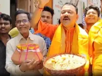 BJP workers celebrate West Bengal election lead with jhalmuri and kamala bhog