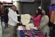 CM Bhupendra Patel shops at Garvi Gurjari on National Handloom Day