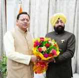 CM Dhami Calls on Governor Gurmeet Singh at Lok Bhavan