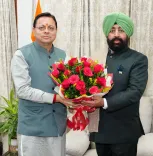 CM Dhami Calls on Governor Gurmeet Singh at Lok Bhawan