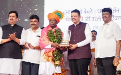 CM Fadnavis honours ex-minister Annasaheb Dange at Sangli autobiography launch