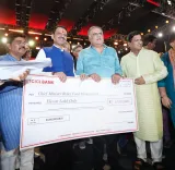 CM Fadnavis receives ₹11 lakh cheque for drought-hit farmers