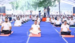 CM Majhi joins mass yoga session at Kalinga Stadium on Yoga Day