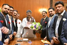 CM Shivakumar meets NRK delegation from 30 countries at Vidhana Soudha