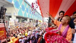 CM Yogi showers flowers on Kanwariyas in Meerut during Shravan