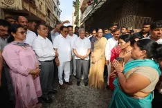 CR Paatil Distributes Flood Relief Cash Doles in Surat's Patel Nagar