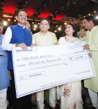 Donor hands CM Fadnavis ₹1,01,000 cheque for drought farmers