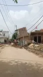 ग्रेटर नोएडा के तिलपता में नाले की खुदाई से दो मंजिला मकान और दुकान ढही, बिजली आपूर्ति बाधित