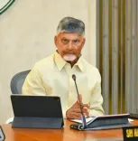 How is CM Naidu managing the heavy rain situation in Andhra Pradesh from Dubai?