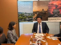 How are Indian envoy and Japan's Chief Cabinet Secretary working to strengthen bilateral ties?