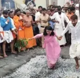 Did Karnataka's Deputy Commissioner Capture Hearts by Participating in a Fire-Walking Ritual?