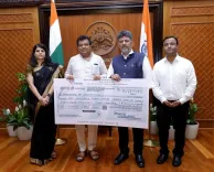 KSIIDC hands Rs 143 cr dividend, Rs 3 cr relief fund cheque to CM Shivakumar
