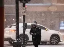How is a massive winter storm affecting the US travel and power?