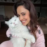 Nushrratt Bharuccha's monsoon mood: cat cuddles and balcony bliss