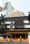 Sensex, Nifty close higher amid volatile trading