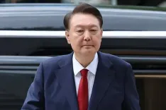 Why has South Korea's Ex-President Yoon been indicted along with 11 others?