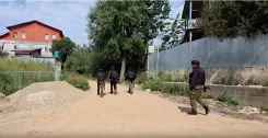 Unidentified body found at Shopian encounter site; arms recovered