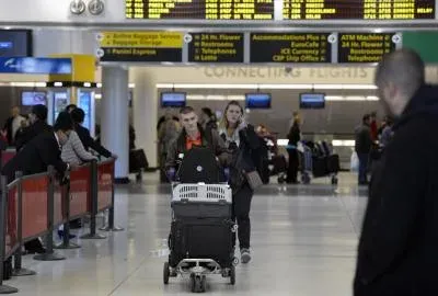 US tightens Ebola travel curbs after American tests positive in Africa