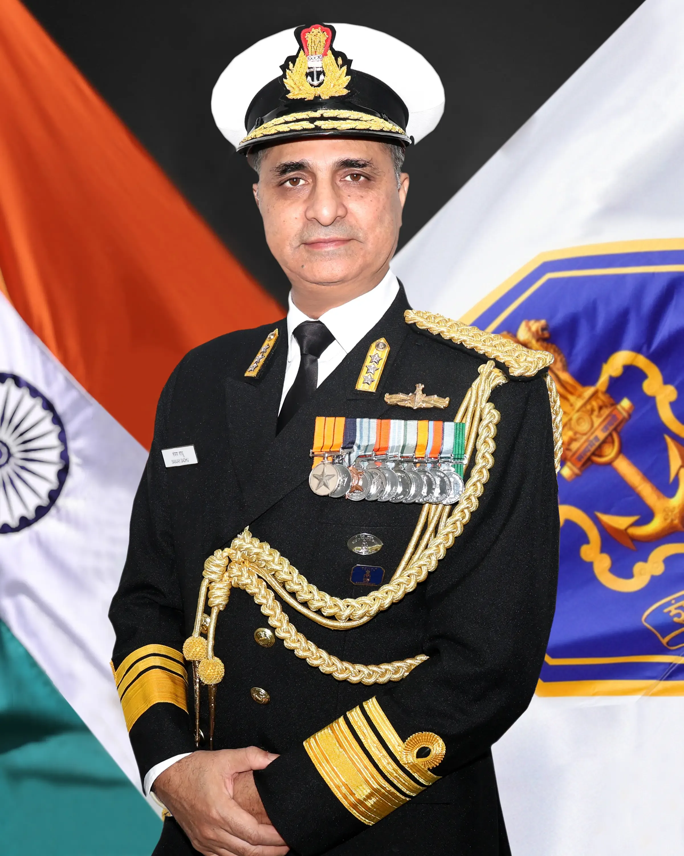 Who is Vice Admiral Sanjay Sadhu, the new controller of warship production?